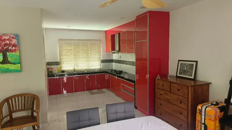Kitchen features: red high-gloss cabinetry, black countertop, stainless-steel sink, chrome pull-down faucet, built-in oven, freestanding range oven, ceramic tile flooring, window with blinds, recessed downlights, kitchen island, wall-mounted cabinets, open shelving, decorative artwork on wall; style: modern. Dining features: dining table with grey upholstery, 4 dining chairs, wooden dresser, decorative frame on dresser, wooden chair, luggage bag.