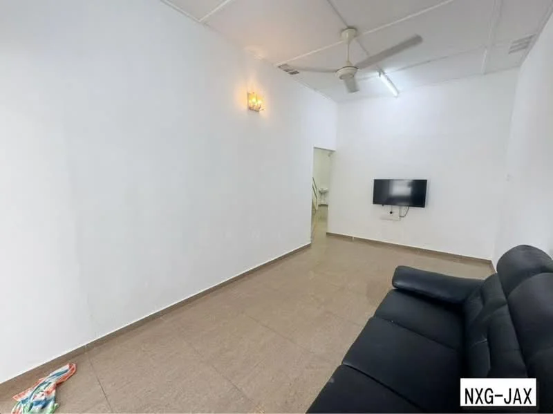 Living features: white painted walls, glossy tile flooring, 5-blade ceiling fan, wall-mounted TV, black fabric sofa, wall sconce lighting, open layout, natural light from doorway.