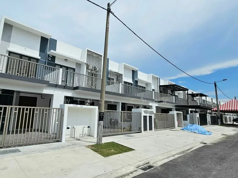 Exterior type: linked terrace house; features: white painted facade, grey accent panels, balconies with railings, flat roof, two-storey structure, manicured lawn, paved walkway, visible utility connections, street lighting, fenced front yard; style: modern.