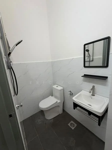 Bathroom features: white painted walls, grey marble tile cladding, dark grey floor tiles, single-sink vanity with wall-mounted cabinet, chrome basin mixer faucet, framed mirror, one-piece toilet, shower with handheld showerhead, drain in floor; style: modern.