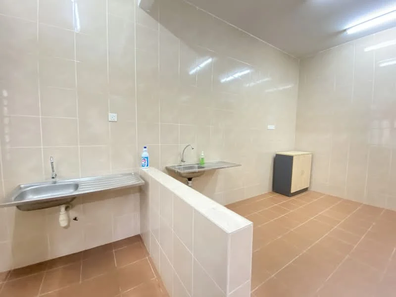 Room features: light beige tiled walls, light beige tiled flooring, stainless-steel sink, single-bowl stainless-steel sink, chrome faucet, countertop with splashback, built-in cabinetry in light wood, fluorescent ceiling lights; style: modern.