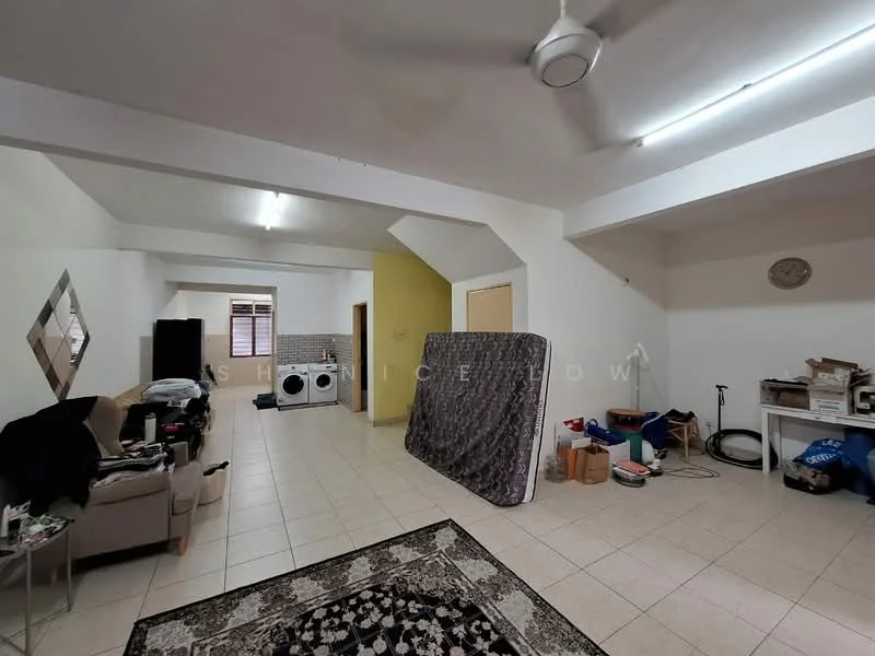 Room features: tiled flooring, white painted walls, exposed ceiling beams, ceiling fan, large mirror on wall, sofa, laundry area with washing machine, mattress leaning against wall, decorative area rug, boxes and miscellaneous items on floor.