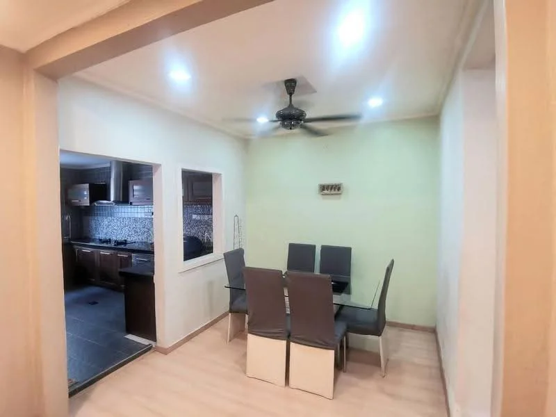 Dining features: 6-seater dining table, grey upholstered dining chairs, ceiling fan with light, light-colored walls, laminate flooring, recessed downlights; style: modern. Kitchen features: kitchen visible through archway, dark wooden cabinetry, stainless-steel appliances, tile backsplash, black countertop; style: modern.
