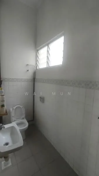 Bathroom features: white tiled walls, grey tiled flooring, single-sink vanity, toilet, shower with wall-mounted faucet, window with horizontal slats.