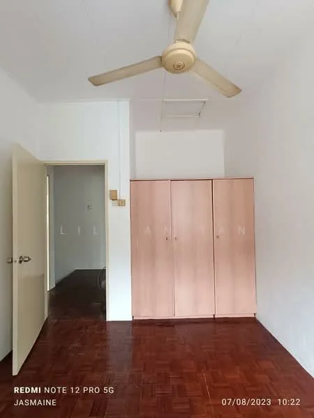 Room features: wooden flooring, white painted walls, ceiling fan, built-in wardrobe with pink doors, door leading to another room, window, light fixture in ceiling, neutral decor; style: minimalist.