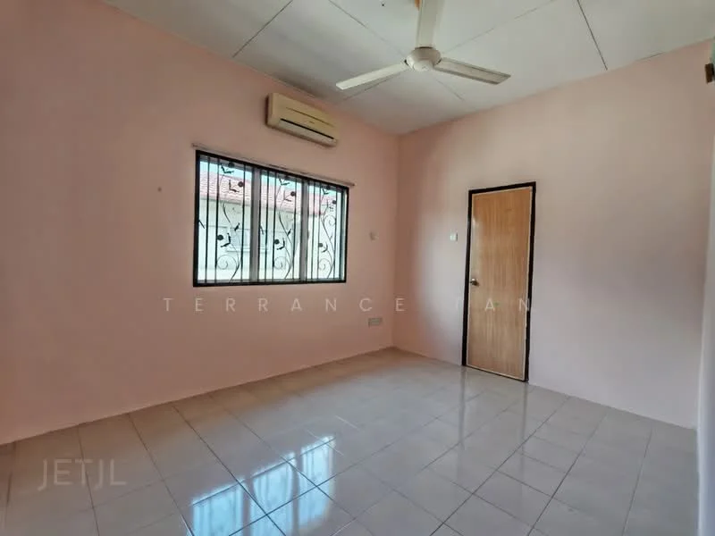 Room features: pink painted walls, white ceiling, ceramic tile flooring, 1 wall-mounted split AC, ceiling fan, window with security bars, wooden door, no visible furniture.