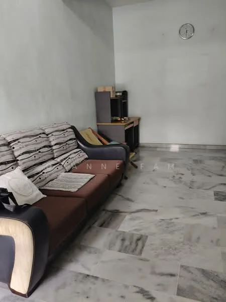 Living features: grey marble flooring, light grey painted walls, 3-seater fabric sofa in brown and black, throw pillows in various colors, wooden side table, wall clock, open space, natural light from window; style: modern.