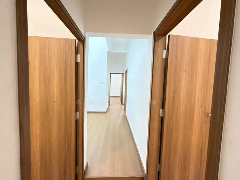 Room features: light wood flooring, white painted walls, wooden doors, door frames with wood finish, ceiling with no visible fixtures, narrow hallway layout; style: modern.