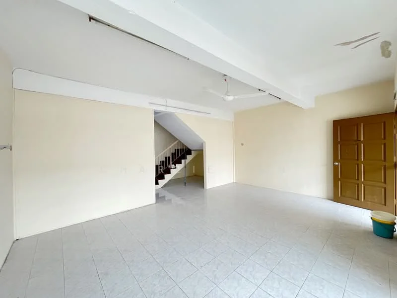 Living features: white painted walls, ceramic tile flooring, exposed ceiling beams, 5-blade ceiling fan, staircase leading to upper floor, large empty space, door leading to another room, window for natural light.