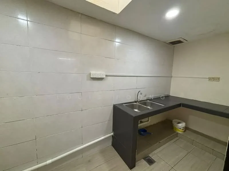 Room features: grey tiled walls, white tiled backsplash, black countertop, single-bowl stainless-steel sink, chrome faucet, light grey floor tiles, exposed plumbing, wall-mounted electrical outlets; style: modern.