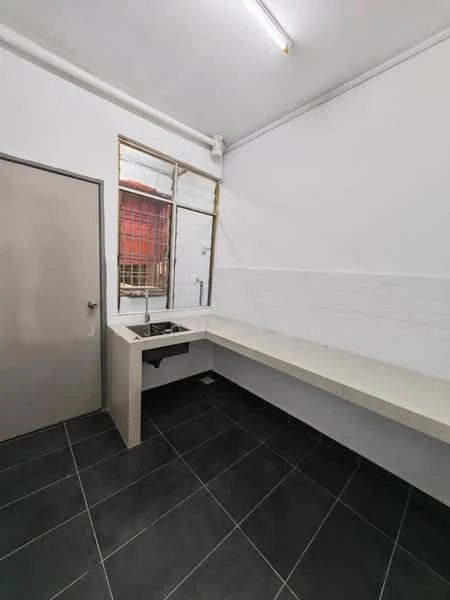 Kitchen features: white painted walls, black tile flooring, single-bowl stainless-steel sink, chrome pull-down faucet, long countertop, window with metal grille, built-in cabinetry, fluorescent ceiling light; style: modern.