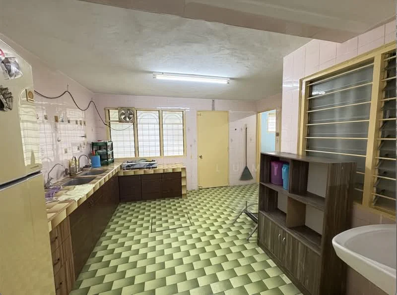 Kitchen features: green and yellow checkered vinyl flooring, pink tiled walls, white cabinetry with wooden handles, double-bowl stainless-steel sink, chrome faucet, built-in gas stove, exhaust fan, refrigerator, window with metal grilles, open shelving, wooden countertop, light fixture on ceiling.