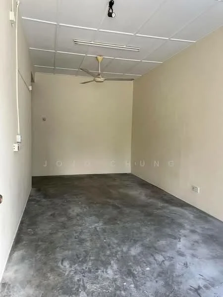 Room features: concrete flooring, white painted walls, ceiling fan, fluorescent lighting, no visible windows, empty space; style: minimalist.