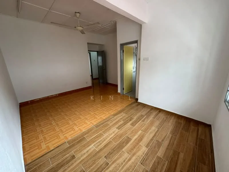 Room features: white painted walls, wooden flooring, ceiling fan, doorway leading to another room, window with no visible treatment, light source from ceiling, open layout, tile flooring in adjacent area.