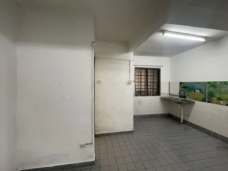 Room features: white painted walls, grey tiled flooring, single-bowl stainless-steel sink, wall-mounted faucet, window with security bars, tile backsplash with floral pattern, overhead fluorescent lighting.