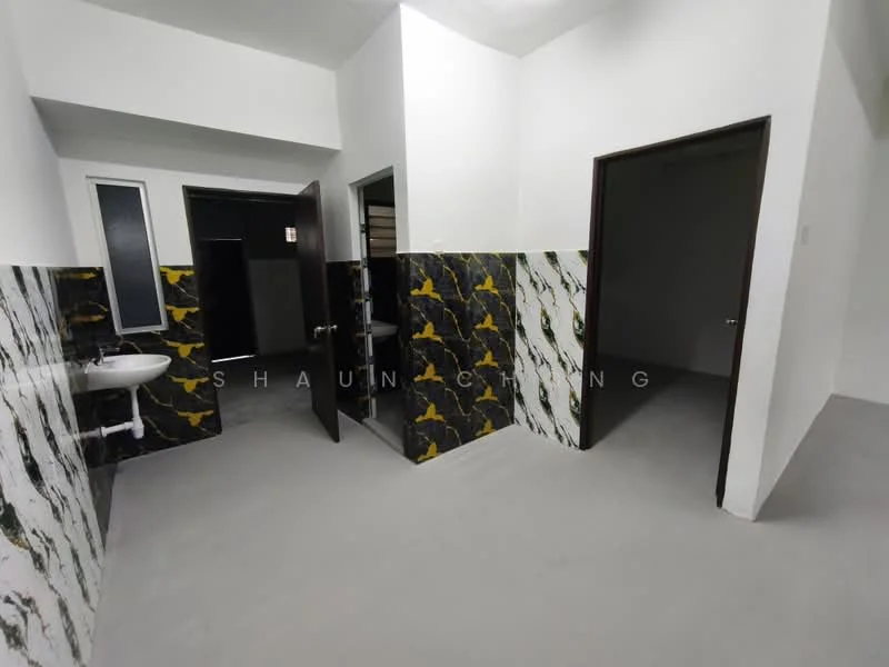 Room features: grey flooring, white painted walls, black and gold marble accent wall, sink, door leading to another room, door leading to bathroom, window with frosted glass, light ceiling; style: modern.