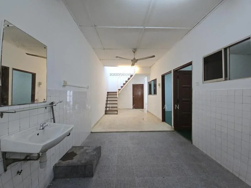 Room features: white painted walls, grey tiled flooring, ceiling fan, mirror above sink, sink with faucet, staircase leading to upper floor, doorway leading to other rooms, window with glass pane; style: minimalist.