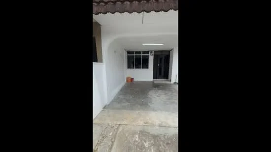 Exterior type: linked terrace house; features: white painted facade, flat roof, concrete flooring, single-storey, front porch area, large window, main entrance door, minimal landscaping; style: modern.