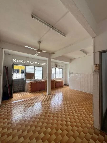 Kitchen features: ceiling fan, tile flooring in orange and yellow pattern, white walls, wood cabinetry, countertop, multiple windows for natural light, open layout, high ceiling, wall-mounted light fixtures.