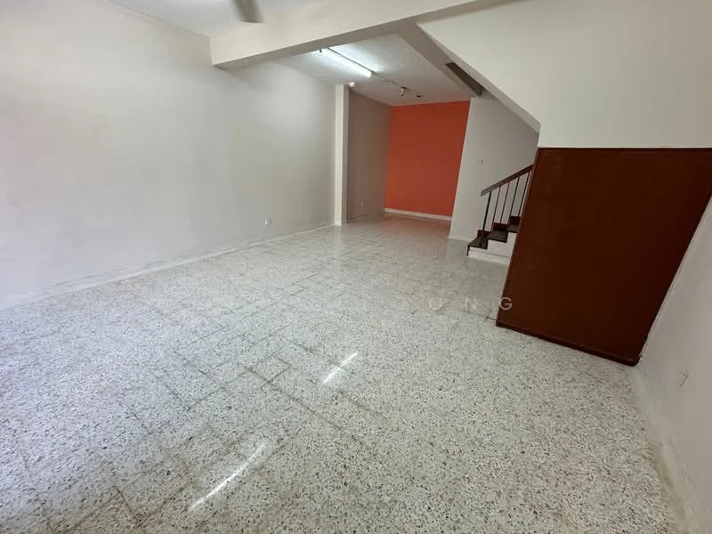 Room features: white painted walls, orange accent wall, terrazzo flooring, staircase with wooden railing, recessed lighting, high ceiling, open layout, natural light from windows; style: modern.