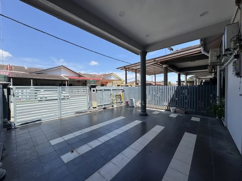 Exterior type: linked terrace house; features: paved flooring with black and white tiles, covered porch area, grey wooden gate, decorative columns, visible air conditioning unit, surrounding residential houses, clear blue sky; style: modern.