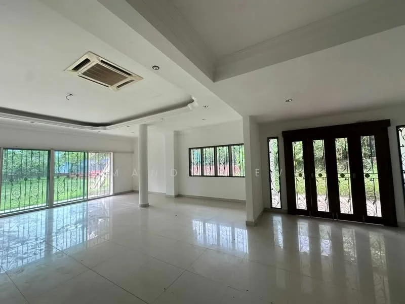 Living features: white painted walls, polished ceramic tile flooring, tray ceiling, recessed downlights, 1 wall-mounted split AC, floor-to-ceiling windows, double doors with decorative ironwork, natural light from windows, open layout; style: modern; view: garden.