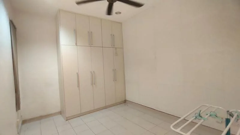 Room features: white painted walls, tile flooring, built-in wardrobe with multiple doors, ceiling fan, window with no visible treatment, laundry drying rack.