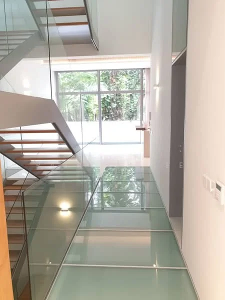 Room features: glass flooring, wooden staircase with glass railing, large windows allowing natural light, white painted walls, minimalist design, modern lighting fixtures, open space layout, greenery visible outside; style: modern; view: garden.