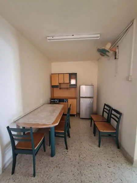 Dining features: rectangular wooden dining table, 6 wooden dining chairs with green frames, cream painted walls, speckled tile flooring, refrigerator, wooden cabinet with glass doors, ceiling fan, fluorescent ceiling lights.