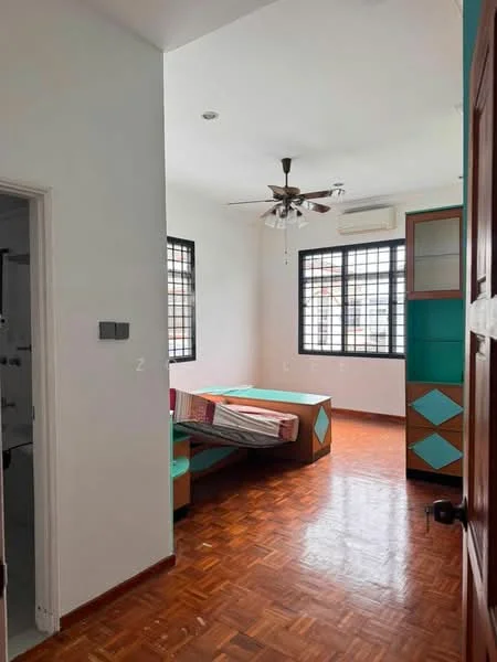 Room features: wooden flooring, white painted walls, ceiling fan, window with black metal grille, built-in cabinetry with green and brown accents, single bed with mattress, decorative wall with geometric pattern, air conditioning unit; style: modern.