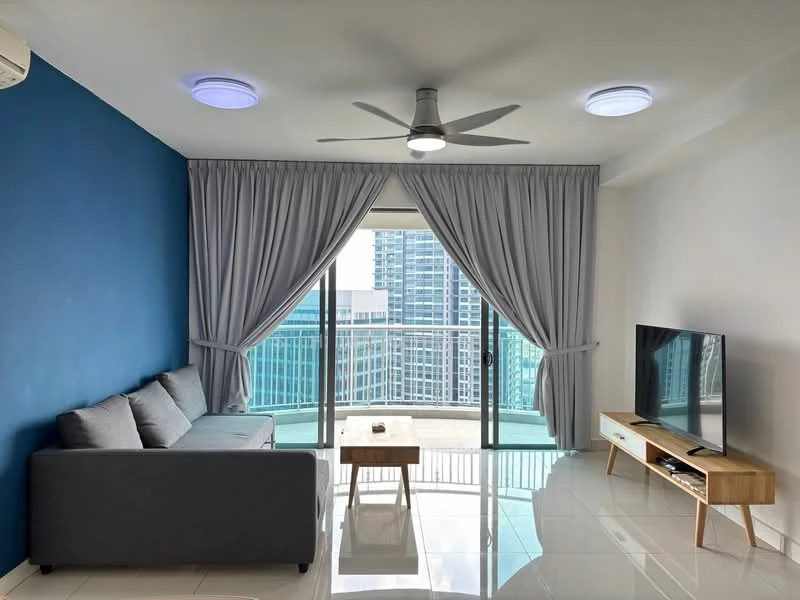 Living features: grey fabric sofa, wooden coffee table, wall-mounted TV, TV console in light wood, floor-to-ceiling windows, curtains in light grey, white tiled flooring, 5-blade ceiling fan with light, recessed ceiling lights, blue accent wall; style: modern; view: city.