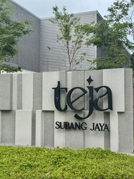 Exterior features: concrete signage, landscaped greenery, modern facade, trees in vicinity, grey and white color scheme; style: modern.
