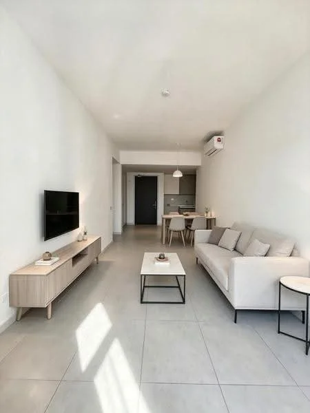 Living features: light grey fabric sofa, wooden coffee table, flat-screen TV on wooden console, white walls, tile flooring, recessed ceiling lights, 1 wall-mounted split AC, dining table with chairs in background, pendant light above dining area, large windows allowing natural light; style: modern.