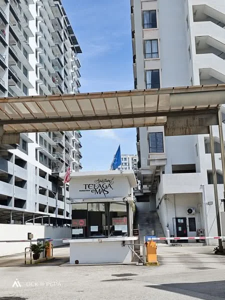 Exterior type: high-rise condominium; features: guard house at entrance, gated entry, multi-storey car park, driveway with interlocking pavers, surrounded by mature greenery, feature water wall, marble flooring at entrance; style: modern.