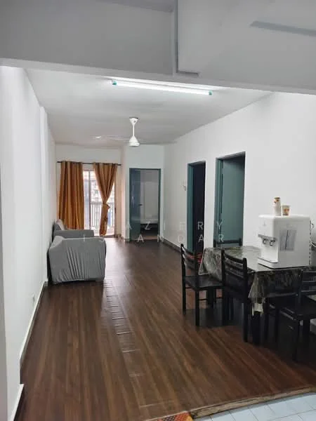 Living features: laminate wood flooring, white painted walls, 5-blade ceiling fan with light, sofa covered in grey fabric, dining table with four black chairs, kitchenette with white cabinetry, window with sheer curtains, decorative tablecloth on dining table; style: modern.