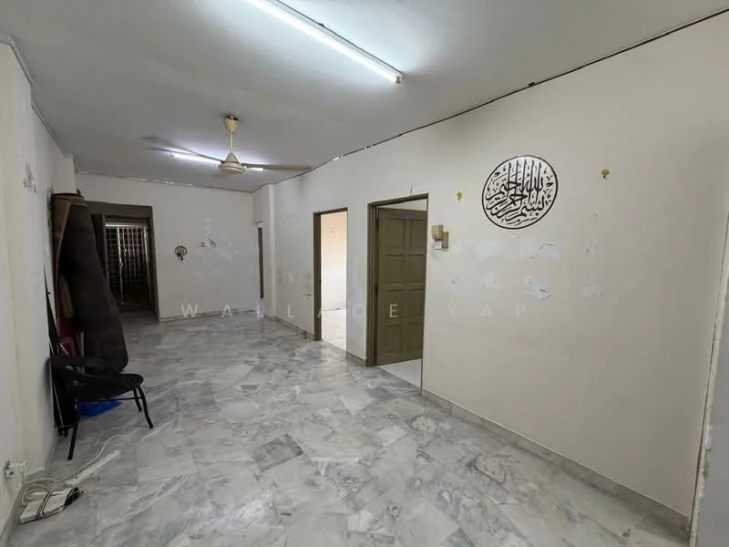 Room features: marble flooring, white painted walls, ceiling fan, doorway to adjacent rooms, light fixtures on ceiling, decorative wall art, empty space, no visible furniture.