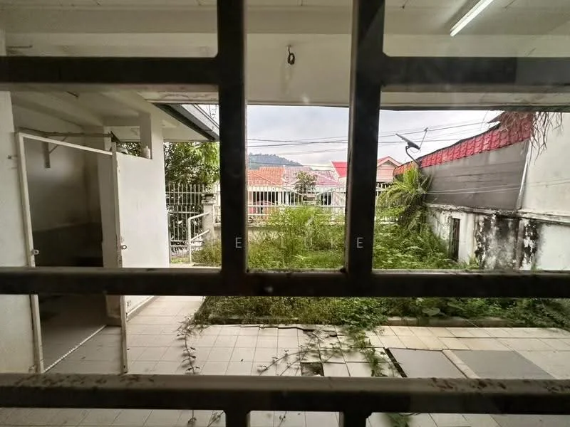 Room features: grassy area, paved flooring, fenced perimeter, overgrown vegetation, exterior wall, window view, doorway, roof overhang; view: garden.