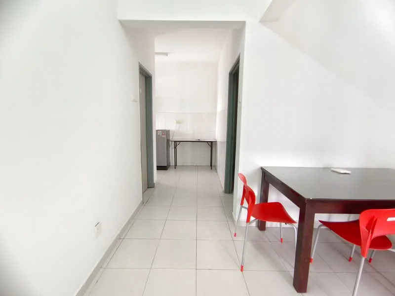 Room features: white painted walls, tile flooring, rectangular dining table, red plastic dining chairs, refrigerator, open layout, natural light from hallway; style: minimalist.