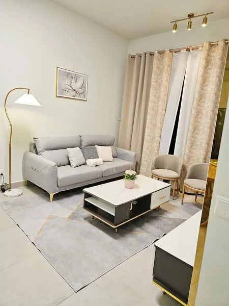 Living features: 3-seater fabric sofa in light grey, decorative cushions, coffee table with white top and black drawers, area rug in light grey, floor lamp with white shade, curtains in beige with floral pattern, two upholstered chairs in light grey, framed artwork on wall, recessed ceiling lights; style: modern.