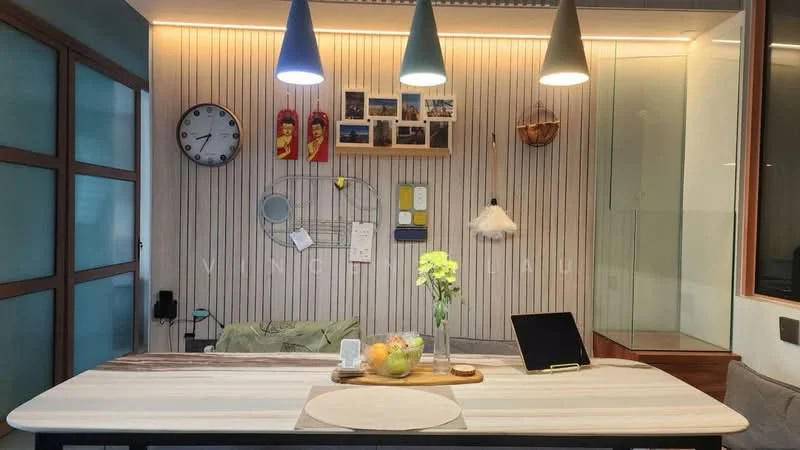 Dining features: wooden dining table, 4 upholstered dining chairs, pendant lighting with three colored shades, wall-mounted clock, decorative wall art, striped wall paneling, greenery in vase, laptop on table, fruit bowl with assorted fruits, glass wall section, cushioned seating area, wall-mounted shelving; style: modern.