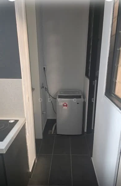 Laundry features: top-load washing machine, grey cabinetry, black tiled flooring, white walls, window for natural light, plumbing connection, countertop space, light fixture; style: modern.