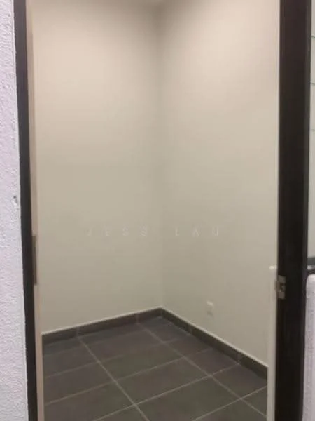 Room features: white painted walls, grey tile flooring, single door, corner space.