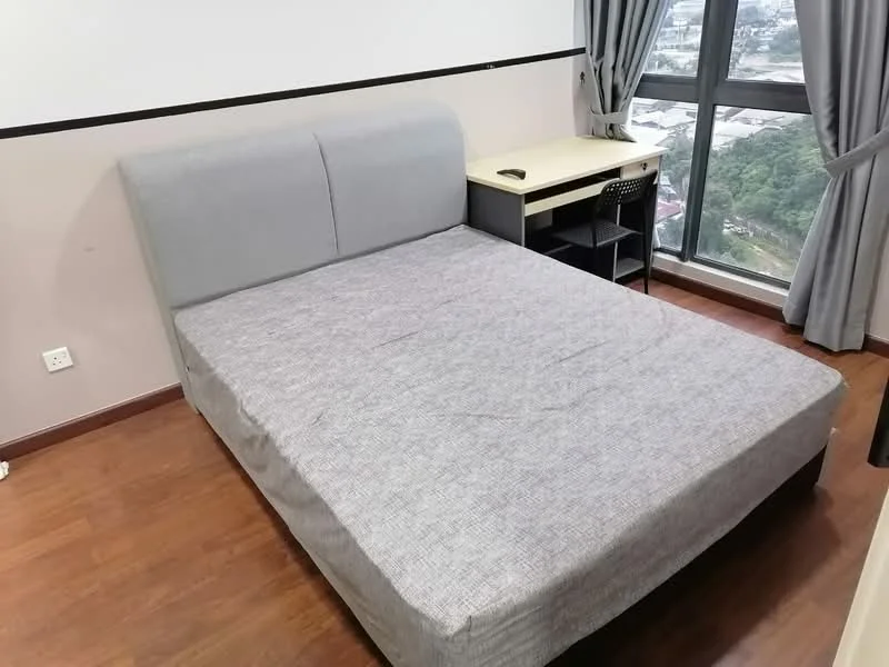 Bedroom features: queen-size bed with grey upholstered headboard, wooden flooring, floor-to-ceiling window, grey curtains, study desk with chair, wall-mounted electrical outlet, neutral wall colour, decorative wall trim; style: modern; view: city.