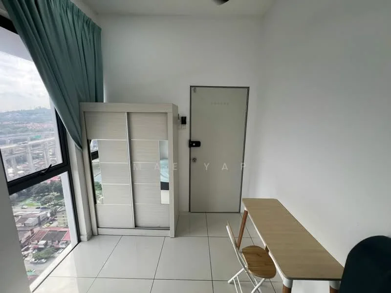 Room features: white painted walls, large floor-to-ceiling window, white tiled flooring, light blue curtains, built-in wardrobe with sliding doors, wooden study table, white chair, door with security lock; style: modern; view: city.