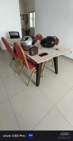 Dining features: dining table with light wood surface, 4 red upholstered dining chairs, black office chair, 2 motorcycle helmets, brown leather bag, smartphone, ceramic tile flooring, white painted walls.