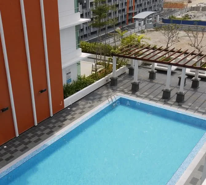 Exterior type: mid-rise condominium; features: swimming pool, pool deck with loungers, pergola with columns, landscaped garden area, grey tiled flooring, orange painted facade, surrounding greenery, adjacent construction site; style: modern.