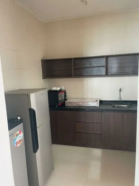 Kitchen features: stainless-steel fridge, black countertop, brown cabinetry, built-in oven, microwave, single-bowl stainless-steel sink, chrome pull-down faucet, tile backsplash, cream tiled walls, white tiled flooring; style: modern.