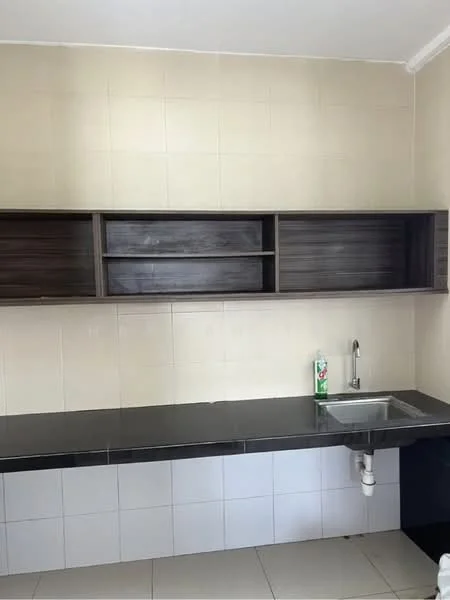 Kitchen features: black granite countertop, single-bowl stainless-steel sink, chrome faucet, white tiled backsplash, wooden upper cabinets, open shelving, grey tiled flooring, cream painted walls; style: modern.
