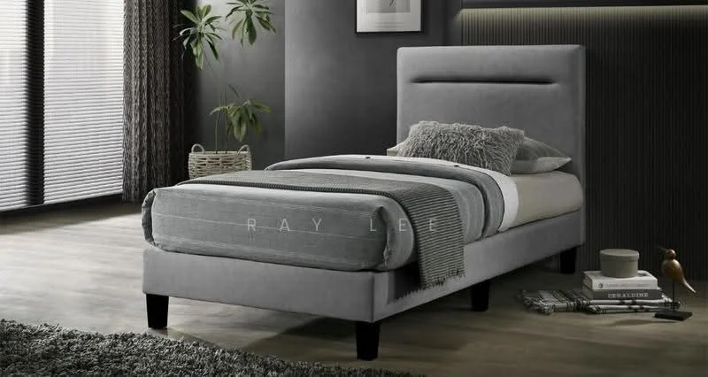 Bedroom features: single bed with upholstered headboard, grey bed frame, plaid bedspread, decorative throw pillow, wooden flooring, area rug with geometric pattern, floor-to-ceiling windows with blinds, potted plant, wall art, nightstand with decorative items; style: modern.