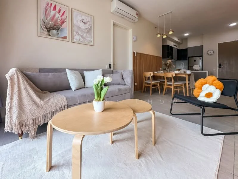 Living features: 3-seater fabric sofa in grey, wooden coffee table, area rug, decorative cushions, wall-mounted air conditioning unit, pendant lighting, wall art with floral prints, dining area visible in background, wooden dining chairs, kitchenette with appliances visible; style: modern.